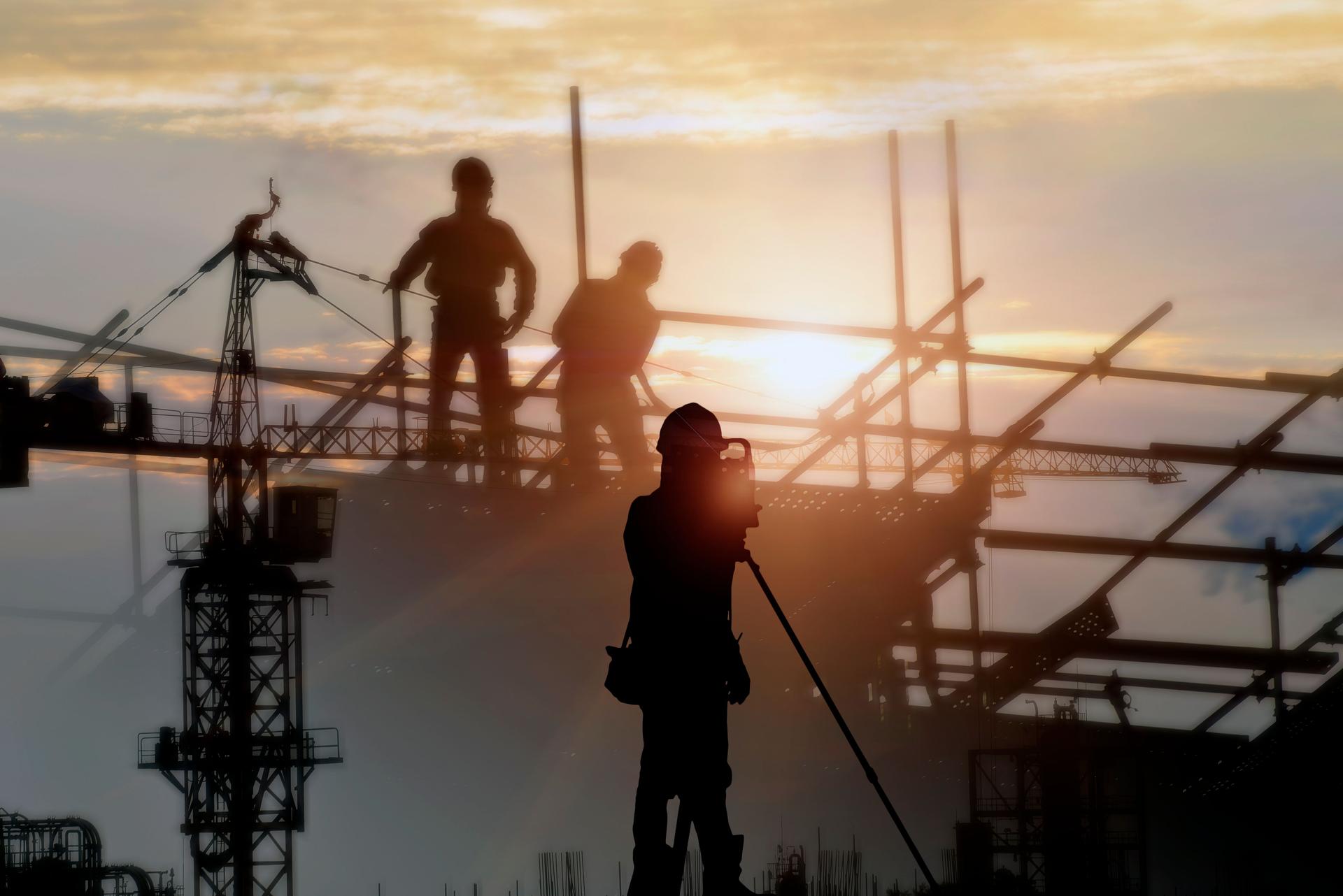 Silhouette construction site  and sunset background.